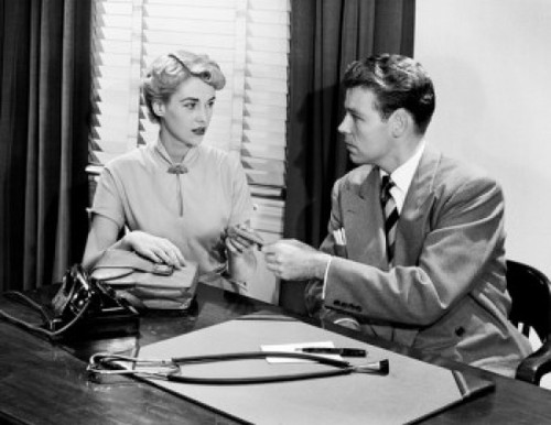Young woman and young man at doctor's office Poster Print - Item # VARSAL255417972