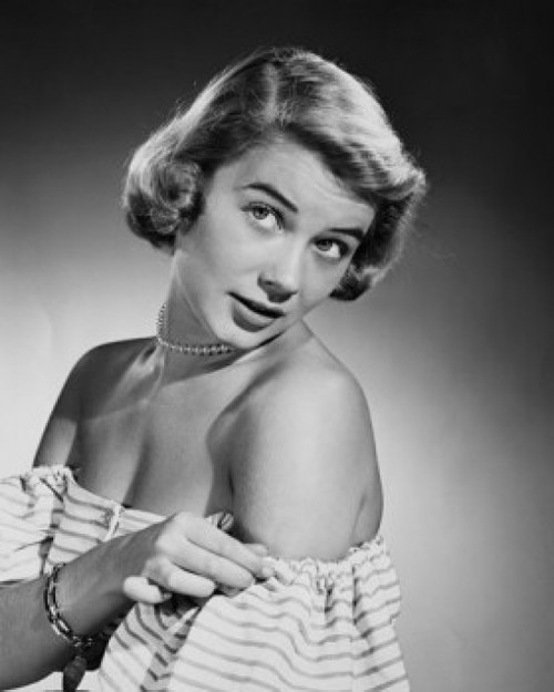 Studio shot of young woman adjusting dress Poster Print - Item # VARSAL2556059