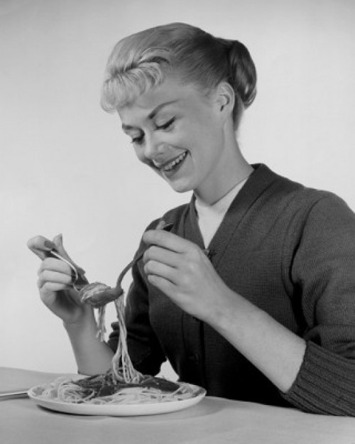 Young woman eating spaghetti Poster Print - Item # VARSAL25512601B