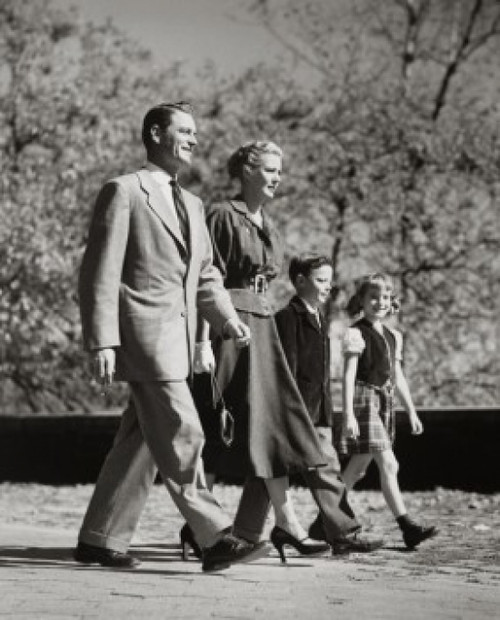 Parents and their children walking in a row Poster Print