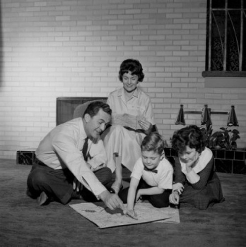 Parents with kids looking at map Poster Print - Item # VARSAL255422675