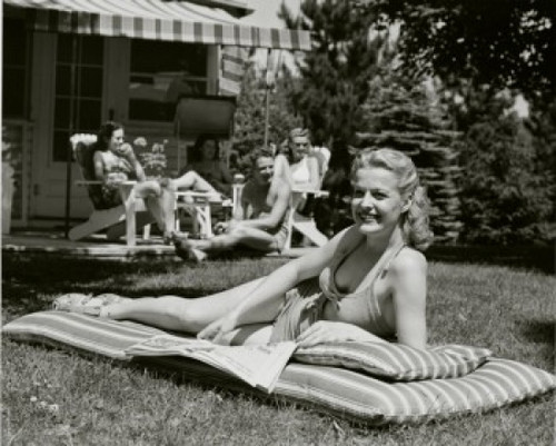 Young woman sunbathing in the backyard Poster Print - Item # VARSAL2552834