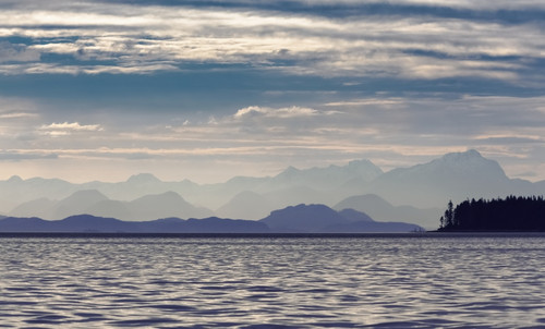 The Coastal Mountain Range Shrouded In A Morning Mist On The Coast; British Columbia, Canada PosterPrint