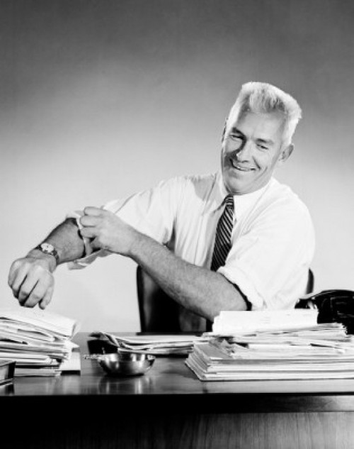 Portrait of businessman at desk preparing to work Poster Print - Item # VARSAL2556570