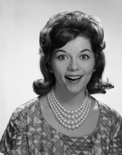 Portrait of young woman smiling  studio shot Poster Print - Item # VARSAL255417357 Portrait of young woman smiling  studio shot Poster Print - Item # VARSAL255417357