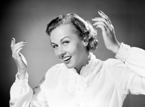 Portrait of young woman smiling and gesturing Poster Print - Item # VARSAL255417971