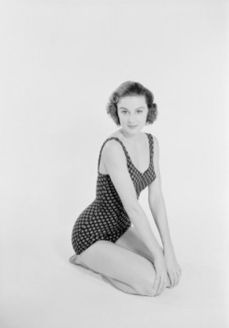 Studio portrait of young woman in swimsuit Poster Print - Item # VARSAL255422267 Studio portrait of young woman in swimsuit Poster Print - Item # VARSAL255422267