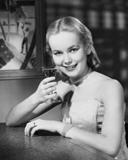 Portrait of a young woman drinking a martini Poster Print - Item # VARSAL25512679A