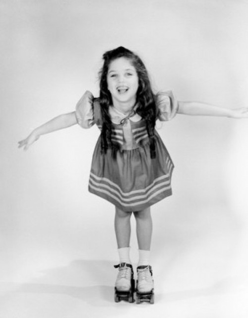 Portrait of girl on roller skate Poster Print - Item # VARSAL255416590