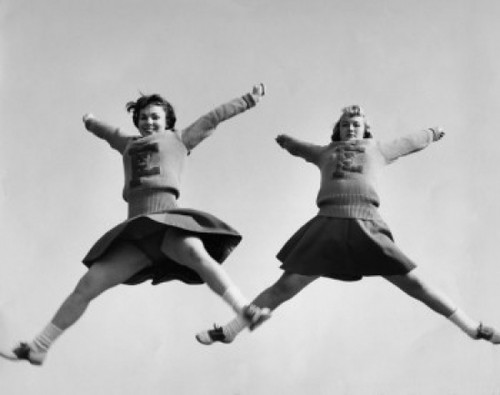 Low angle view of two female cheerleaders cheering Poster Print - Item # VARSAL25515935