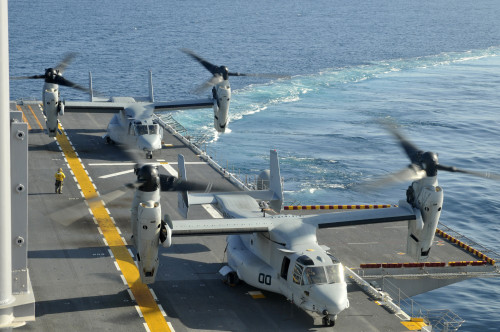Pacific Ocean, February 1, 2012 - MV-22 Osprey land aboard the amphibious assault ship USS Peleliu during flight deck qualifications Poster Print - Item # VARPSTSTK105219M