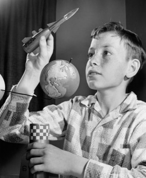 Close-up of a boy holding a model of a rocket Poster Print - Item # VARSAL2555267