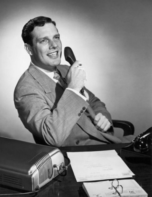 Businessman holding a telephone receiver and smiling Poster Print - Item # VARSAL25517614 Businessman holding a telephone receiver and smiling Poster Print - Item # VARSAL25517614