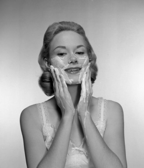 Woman applying face mask Poster Print - Item # VARSAL255416793
