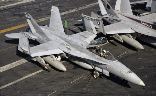 A US Navy F/A-18C Hornet parked on the flight deck of aircraft carrier USS Nimitz Poster Print - Item # VARPSTGCA100102M