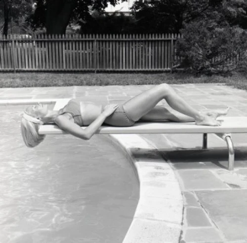 Young woman sunbathing on trampoline Poster Print - Item # VARSAL255421073