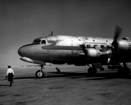Rear view of man running near airplane Poster Print - Item # VARSAL25540512