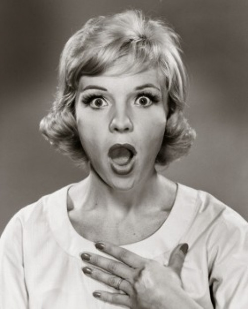 Portrait of a mid adult woman looking surprised Poster Print - Item # VARSAL25511512