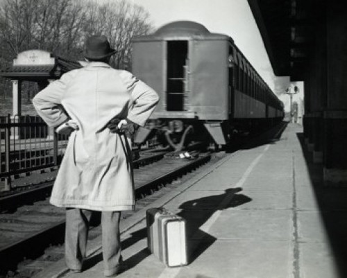 Rear view of a man standing at a railroad station platform Poster Print - Item # VARSAL2556237