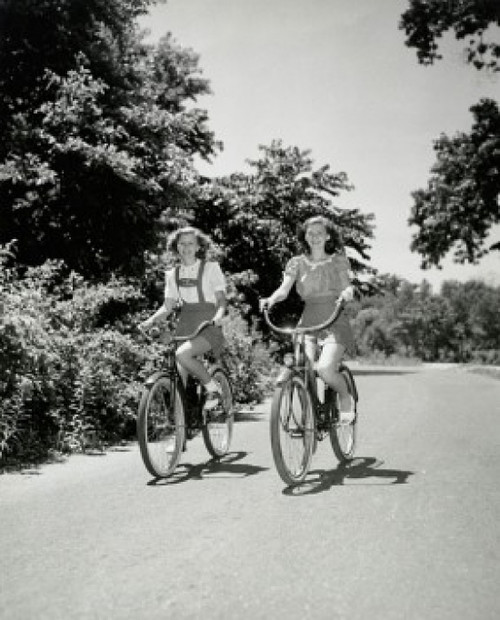 Two teenage girls riding bicycles Poster Print - Item # VARSAL2553907B