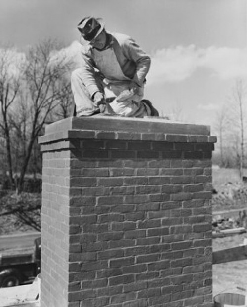 Low angle view of a man repairing a chimney Poster Print - Item # VARSAL25537130