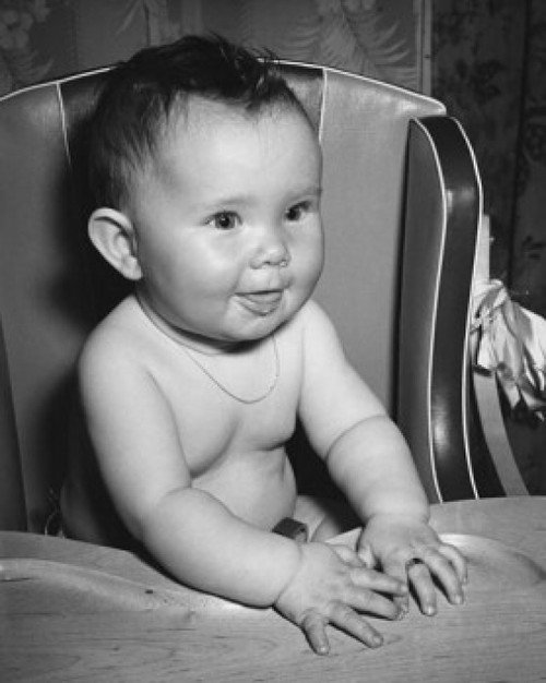Close-up of a baby sitting in a high chair Poster Print - Item # VARSAL2559674