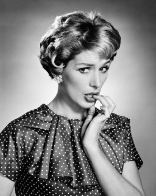 Portrait of young woman biting her nails Poster Print - Item # VARSAL2552828