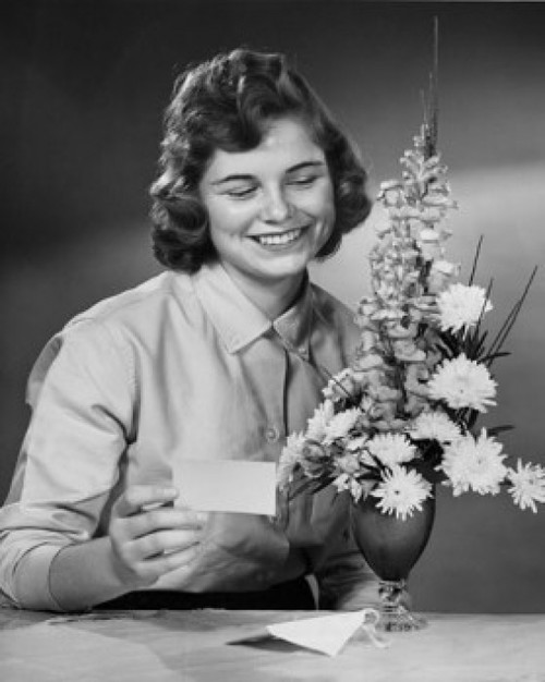 Young woman reading greeting card Poster Print - Item # VARSAL25542085 Young woman reading greeting card Poster Print - Item # VARSAL25542085