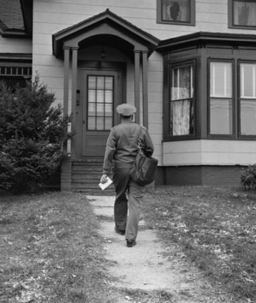 Rear view of a postman delivering mail Poster Print - Item # VARSAL2559066