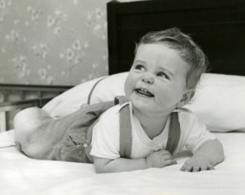 Portrait of baby lying on bed Poster Print - Item # VARSAL255601B