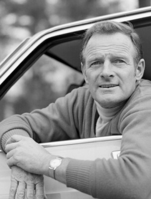 Portrait of mature man looking through car window Poster Print - Item # VARSAL25549038