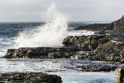 Wave crashing into rocky coast with cloudy sky; Kilkee, County Clare, Ireland PosterPrint - Item # VARDPI12258594