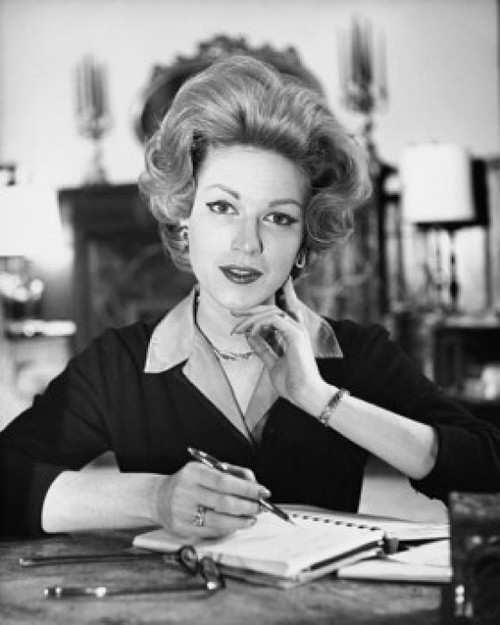 Portrait of a businesswoman writing in a spiral notebook in an office Poster Print - Item # VARSAL25520556