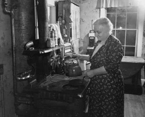 Senior woman holding a tea kettle in the kitchen Poster Print - Item # VARSAL9901966