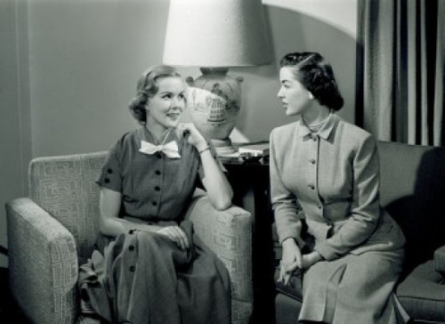 Two women talking in living room Poster Print - Item # VARSAL255418638