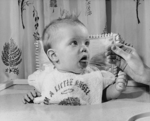Woman feeding a baby Poster Print - Item # VARSAL2559739B