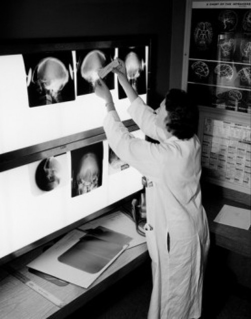 Doctor looking at x-rays Poster Print - Item # VARSAL255418714