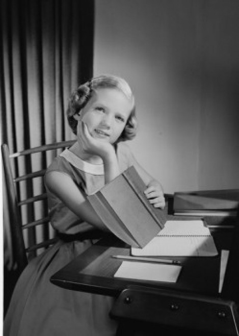 Girl doing homework at desk Poster Print - Item # VARSAL255419027