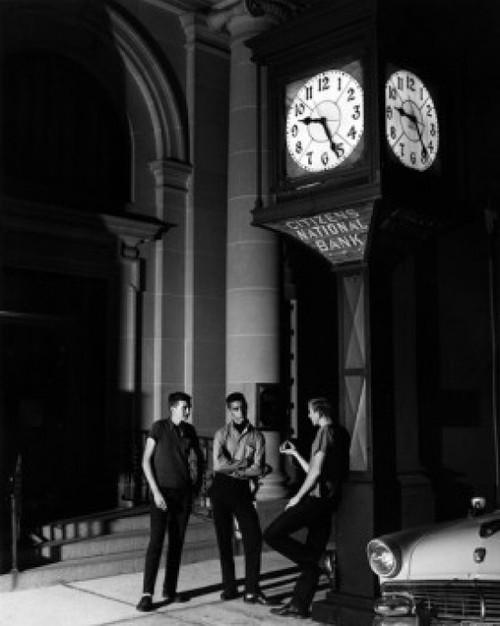 Three men having conversation outside bank at night Poster Print - Item # VARSAL25549575