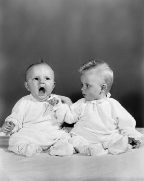 Two babies sitting together Poster Print