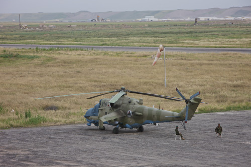 Afghan Army soldiers guard an Mi-35 attack helicopter of the Afghan National Army Air Corps at Kunduz Airfield, Northern Afghanistan Poster Print - Item # VARPSTTMO100531M Afghan Army soldiers guard an Mi-35 attack helicopter of the Afghan National Army Air Corps at Kunduz Airfield, Northern Afghanistan Poster Print - Item # VARPSTTMO100531M