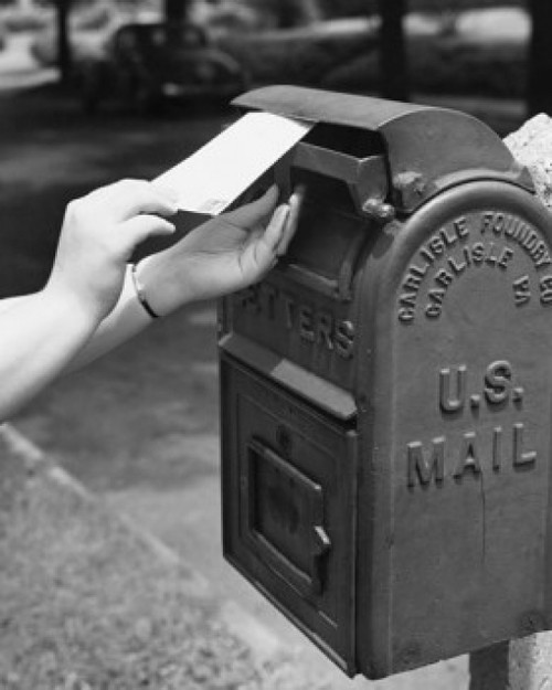 Close-up of a person's hand dropping a letter into a mailbox Poster Print - Item # VARSAL25532638