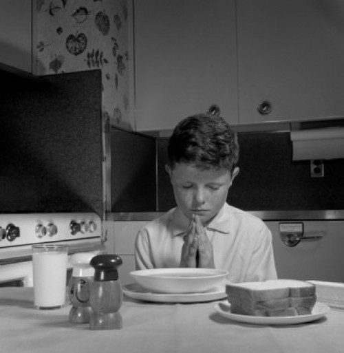 Boy praying before dinner Poster Print - Item # VARSAL255416818