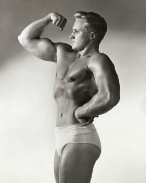Side profile of young man flexing bicep Poster Print - Item # VARSAL2553053