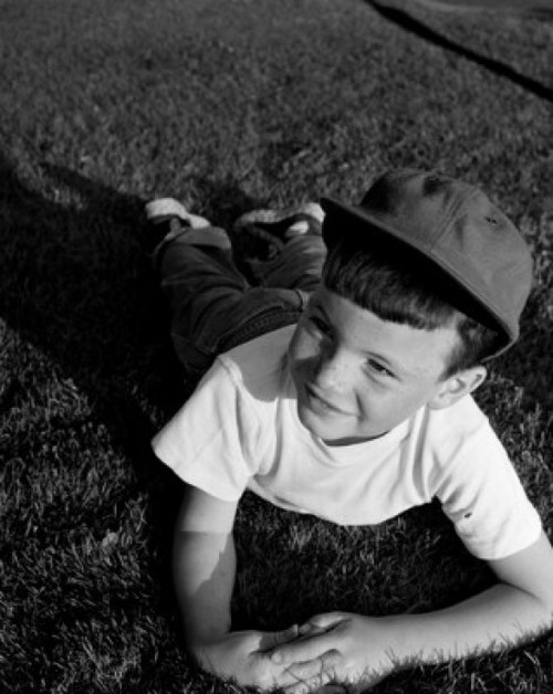 Boy lying on lawn Poster Print - Item # VARSAL255421875