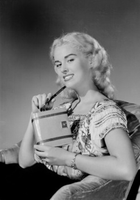 Young woman sitting in chair and holding personal organizer Poster Print - Item # VARSAL255422348B