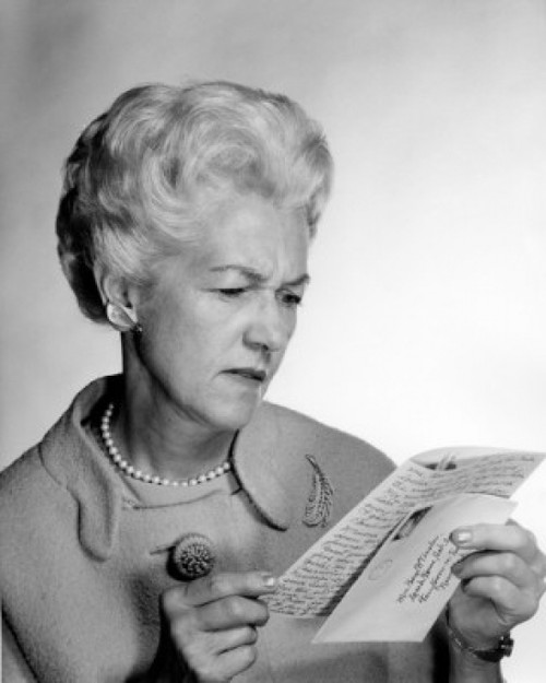 Studio shot of woman reading letter Poster Print - Item # VARSAL25548989