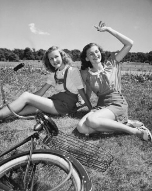 Two teenage girls sitting on grass and smiling Poster Print - Item # VARSAL2555502
