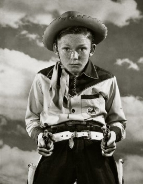 Boy in cowboy costume holding toy guns Poster Print - Item # VARSAL25512963B Boy in cowboy costume holding toy guns Poster Print - Item # VARSAL25512963B