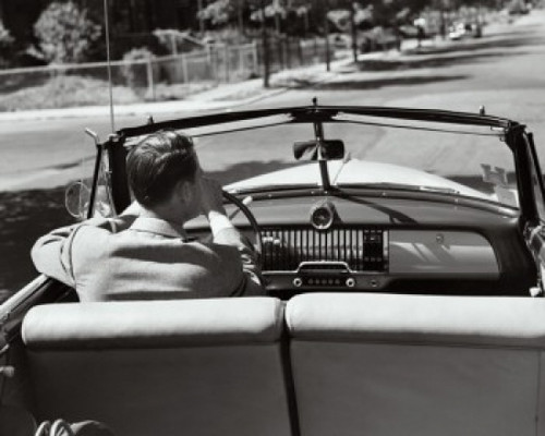 Rear view of a young man driving a convertible car Poster Print - Item # VARSAL25525150